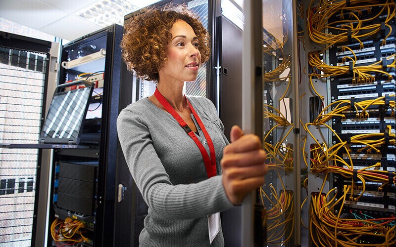 Protect your business with the updated security measures IT technician reviews server logistics in data center