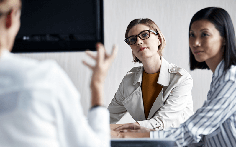 We offer guidance and managed services for your IT operations Business professionals gathered to discuss managed IT services
