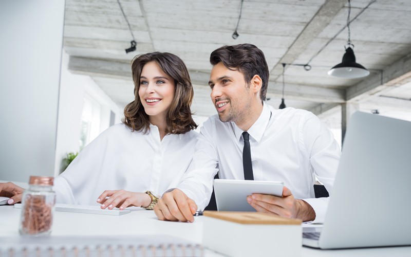We help clients dive deep into various workloads to evaluate every application. Business professionals with devices review workload assessment on computer