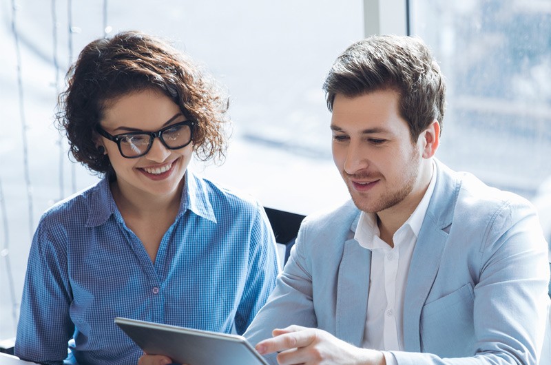 Stronger security Business professionals discussing project while using tablet computer