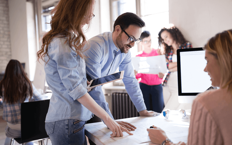 A successful cloud strategy needs to be driven by your unique business needs Team plans out cloud strategy on various devices