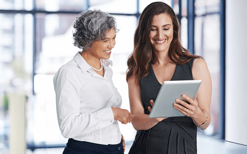 There is a cloud platform best suited for each workload in your business Two business professionals review IT strategy on tablet device