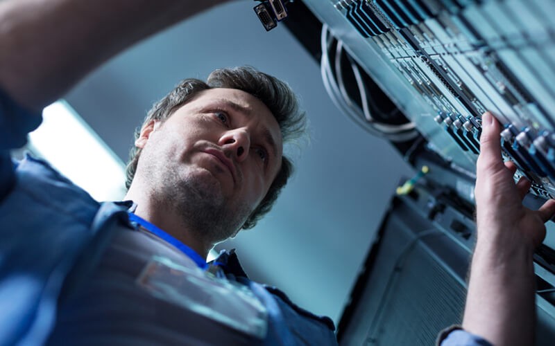 Upgrading only what is necessary can save time and money IT technician works on server rack in data center