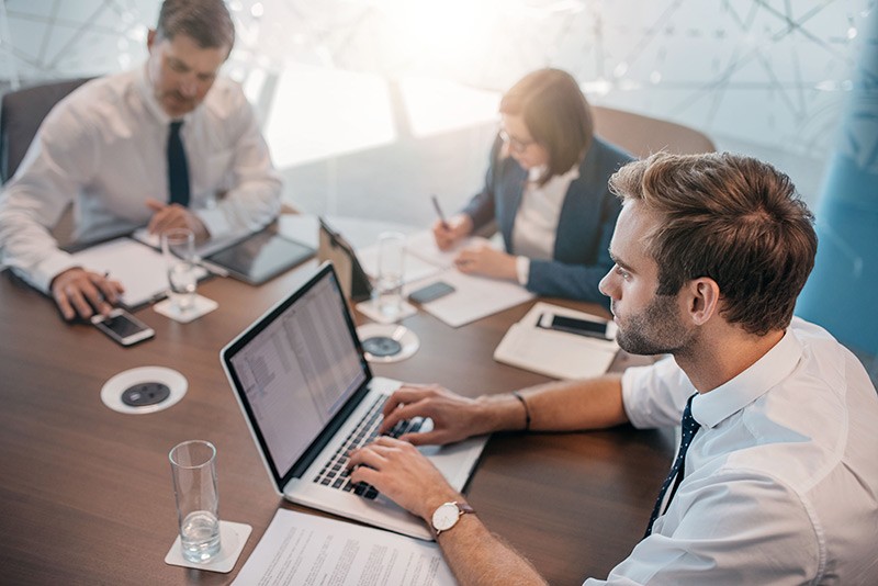 Focus on your business Business manager has team meeting in conference room