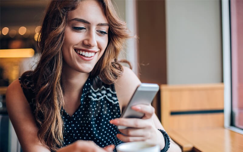 New possibilities for collaboration Smiling woman on mobile device