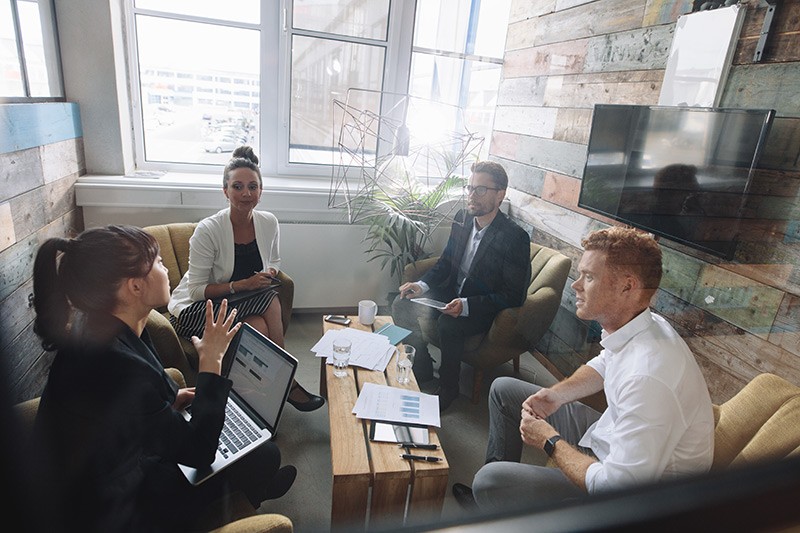 Improved focus on business, not maintenance Business team brainstorms solutions in conference room