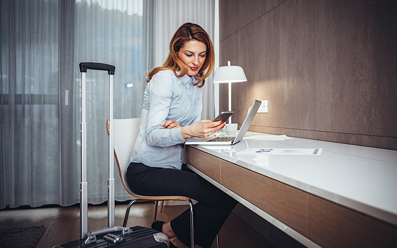 Combining your offerings with the right technology Hotel guest uses her devices with hotel wifi