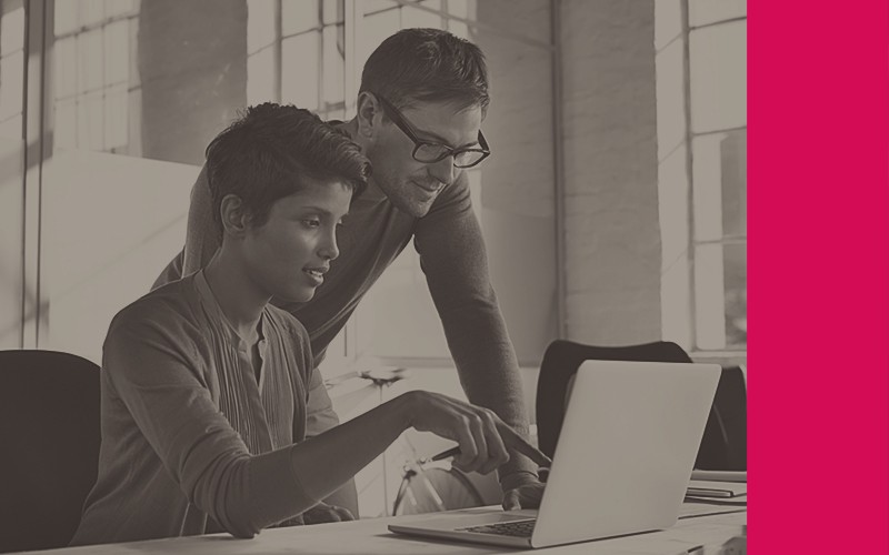 Our procurement tools allow you to purchase devices, licenses and more. Two colleagues view procurement platform on desktop computer