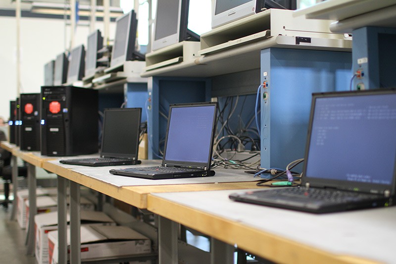 Our integration lab is ISO 9001:2015-certified. Desktop and laptop computers on integration lab bench to be updated