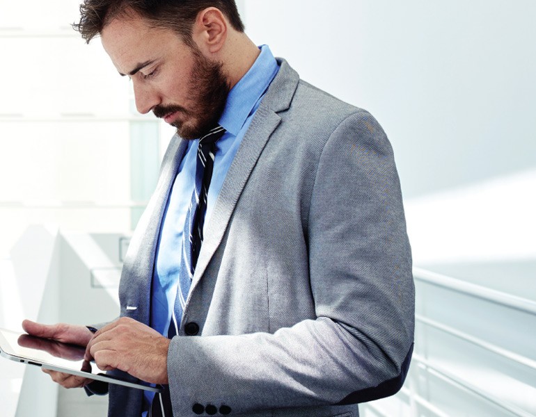 Keep your technology current and meet the demands of technology Business professional reviewing procurement assets off of self-service portal