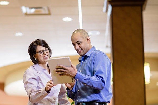 it-technician-business-woman-discuss-tablet-center-left it-technician-business-woman-discuss-tablet-center-left