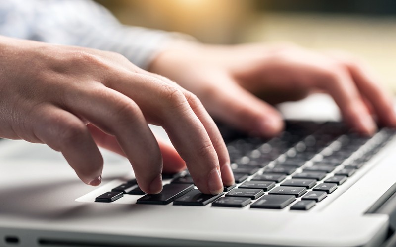 We’ll manage your ecosystem to help you control costs Close up of hands typing on laptop keyboard