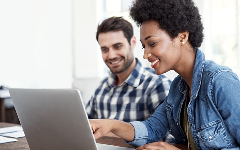 Get a clear picture of your license entitlements Casually dressed employees work on laptop computer