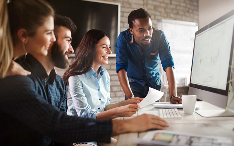 Modern computing devices that work consistently, on demand, with cloud applications Business professionals brainstorming ideas with various mobile technology in hand