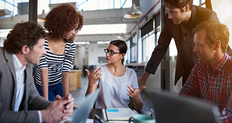 Instantly access comprehensive and secure cloud applications from anywhere Team brainstorm discussion around conference table