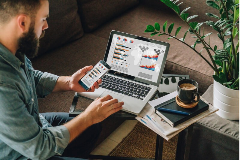 Configure all of your devices with cloud applications Business manager using Office 365 on tablet computer in modern office