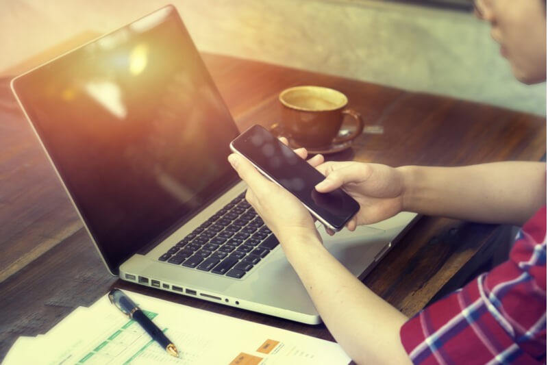 Flexibility to keep pace with your business growth Warehouse manager reviewing client data off tablet computer