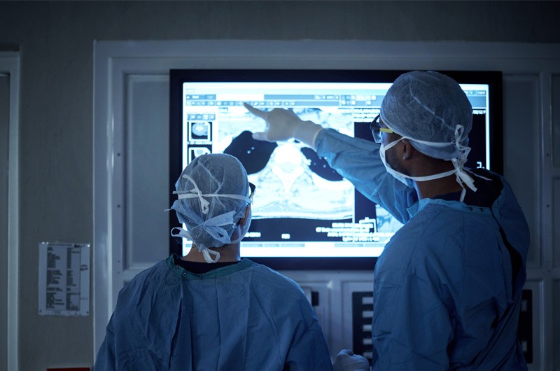 Scale faster, deliver smarter and perform better Surgeons using touch screen display to review patient information during surgery